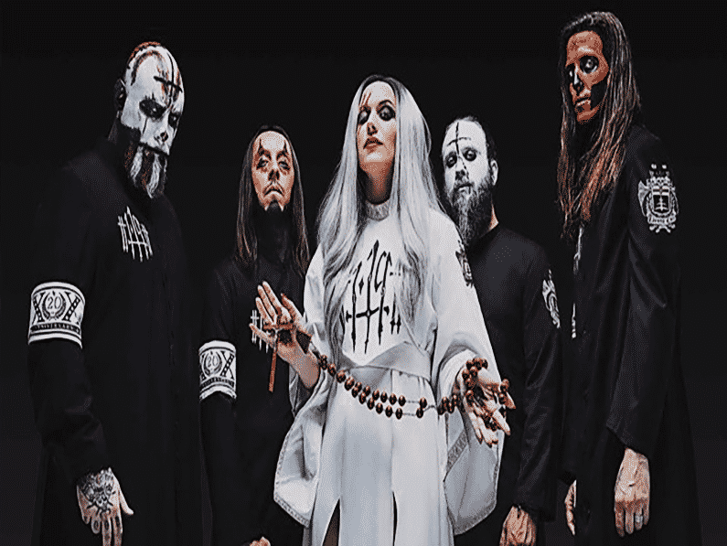 A gothic ensemble with an ethereal appeal, showcasing a mix of dark attire and striking makeup that creates a captivating, mysterious vibe reminiscent of the "Disease Of The Anima Tour.