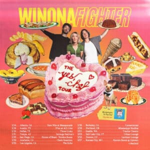 Three People Stand Behind A Large Pink Cake Decorated With &Quot;The Yes Chef Tour.&Quot; They Are Surrounded By Images Of Food, Including Tacos And Pizza. Below Are Tour Dates And Cities For The Winona Fighter Tour. A Dog With A Chef Hat Is Seated By The Cake, Eagerly Awaiting Its Piece.